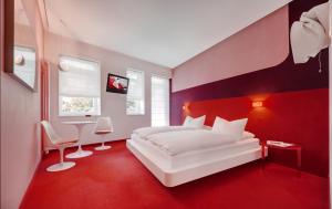 Postel nebo postele na pokoji v ubytování Boutique Hotel Imperialart