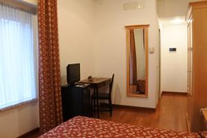 Postel nebo postele na pokoji v ubytování Gorizia Inn