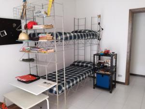 A bed or beds in a room at Olivo apartment with sea view