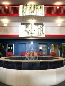 a lobby with a large fountain in the middle at American Inn Kansas City, KS in Kansas City