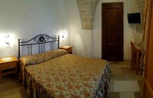 Katil atau katil-katil dalam bilik di Masseria De Michele