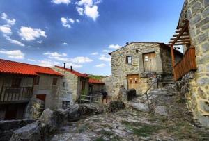 a group of old stone buildings in a village at One Bedroom House in Povoa Dao in Povoa Dao