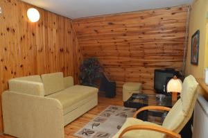 a living room with a couch and a table at Motel Eden in Zamość +48 photos