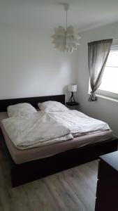 Postel nebo postele na pokoji v ubytování Ferienwohnung am Modenbach