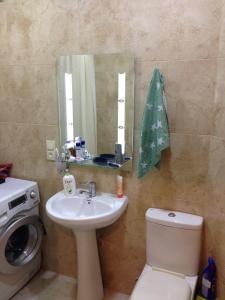 Ванна кімната в Apartment Gamarjoba Batumi