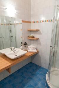 a bathroom with a sink and a shower at BurgenLandhaus in Gols