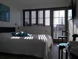 Postel nebo postele na pokoji v ubytování Hals Hotel