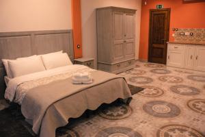Postel nebo postele na pokoji v ubytování Casa Azzopardi Suites