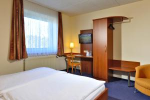 Säng eller sängar i ett rum på Hotel Haus Kronenthal
