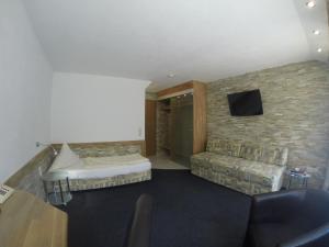 Postel nebo postele na pokoji v ubytování Hotel Wasserfall