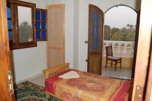 Ένα ή περισσότερα κρεβάτια σε δωμάτιο στο Sakkara Inn