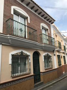 a building with balconies on the side of it at Easy Nerja Apartments in Nerja