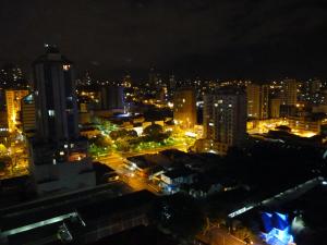 a city at night with lots of tall buildings at Union Residence - Heer Empreendimentos in Novo Hamburgo
