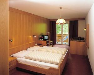 Postel nebo postele na pokoji v ubytování Hotel Klotz
