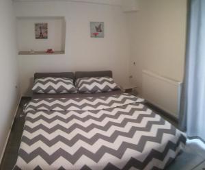 Posteľ alebo postele v izbe v ubytovaní New Apartments