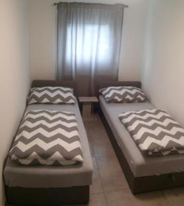 Posteľ alebo postele v izbe v ubytovaní New Apartments