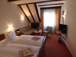 Katil atau katil-katil dalam bilik di Pension Gasthof Zum Lamm