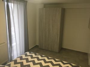 Posteľ alebo postele v izbe v ubytovaní New Apartments