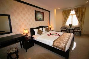 Letto o letti in una camera di Royal Dalat Hotel