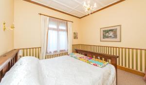 Postel nebo postele na pokoji v ubytování Gumnut House.