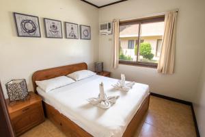 Postel nebo postele na pokoji v ubytování Levantin Boracay