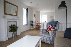 a living room with a couch and a chair at Holiday Home Elerkin in Durham