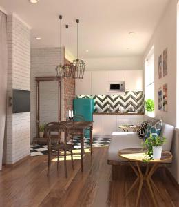 eine Küche und ein Wohnzimmer mit einem Tisch und Stühlen in der Unterkunft Art Studio in Taschkent