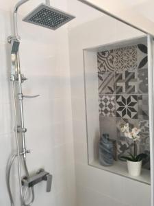 a shower with a glass door in a bathroom at Apartments Aman in Makarska +35 photos