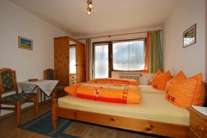 Ένα ή περισσότερα κρεβάτια σε δωμάτιο στο Haus St. Christoph