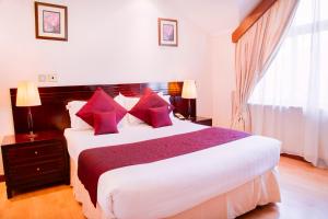 Ένα ή περισσότερα κρεβάτια σε δωμάτιο στο Boma Inn Nairobi