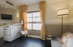 TV a/nebo společenská místnost v ubytování A23 Boutique Hotel