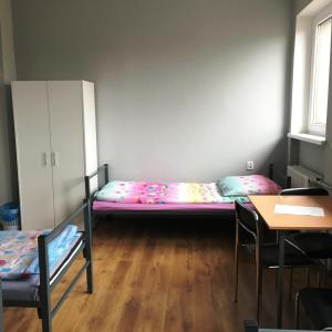 Llit o llits en una habitació de Hostel pod Topolami