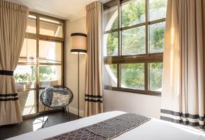 Postel nebo postele na pokoji v ubytování A23 Boutique Hotel