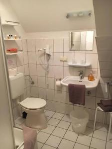 Koupelna v ubytování Dithmarscher Haus