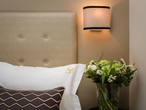 Postel nebo postele na pokoji v ubytování A23 Boutique Hotel