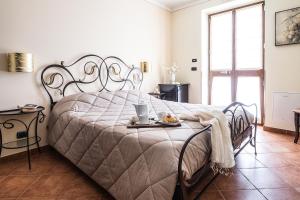 En eller flere senge i et værelse på Costa Catterina B&B