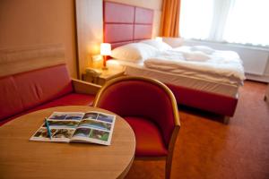 A bed or beds in a room at Hotel Club