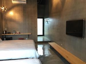 TV a/nebo společenská místnost v ubytování Kenting Xia Ye B&B