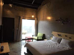 Postel nebo postele na pokoji v ubytování Kenting Xia Ye B&B
