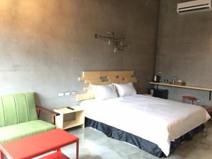 Postel nebo postele na pokoji v ubytování Kenting Xia Ye B&B
