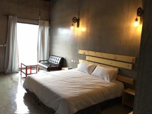 Postel nebo postele na pokoji v ubytování Kenting Xia Ye B&B