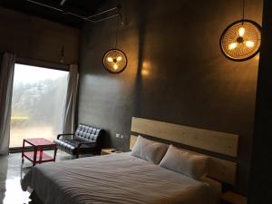 Postel nebo postele na pokoji v ubytování Kenting Xia Ye B&B