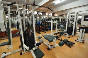 a gym with a lot of treadmills and machines at New Delhi YMCA Tourist Hostel in New Delhi