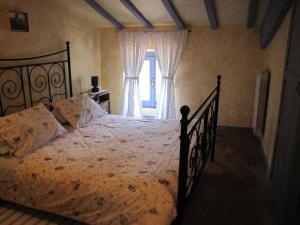 A bed or beds in a room at Maison Dina