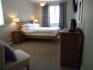 Katil atau katil-katil dalam bilik di Royal Oak Hotel