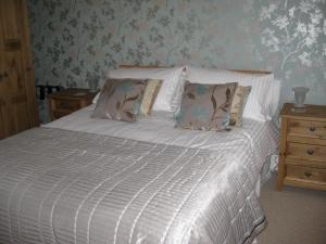 Ένα ή περισσότερα κρεβάτια σε δωμάτιο στο Taylors Guesthouse