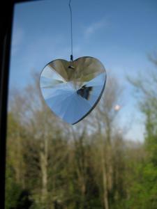 a heart shaped mirror hanging from a car window at Taylors Guesthouse in Salisbury