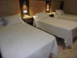 A bed or beds in a room at Cruceiro do Monte