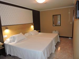 A bed or beds in a room at Cruceiro do Monte