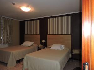 A bed or beds in a room at Cruceiro do Monte